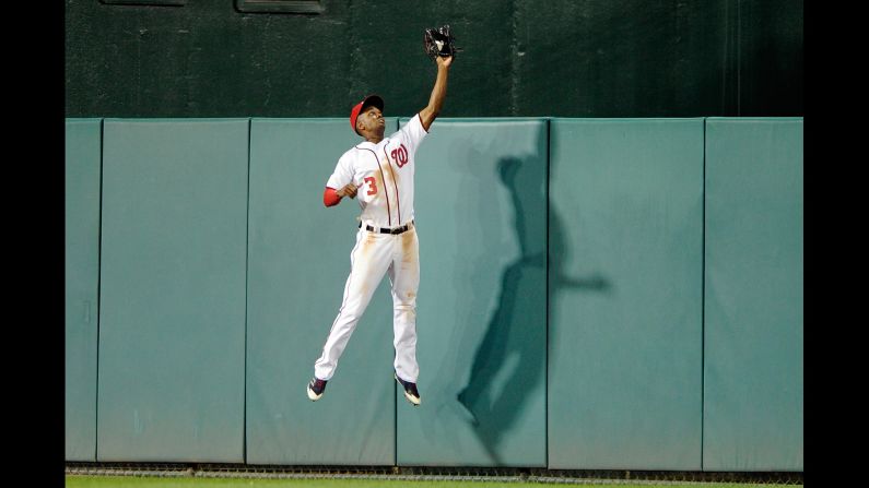 Washington outfielder Michael Taylor makes a catch at the wall during a home game against Philadelphia on Thursday, September 7.