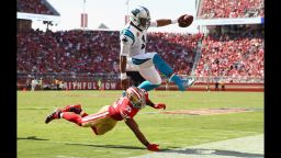 Cam Newton #1 of the Carolina Panthers is tackled by Eric Reid #35 of the San Francisco 49ers on September 10, 2017.