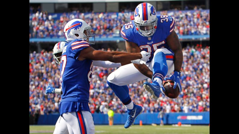 Buffalo fullback Mike Tolbert, right, celebrates with teammate Jordan Matthews after scoring a touchdown in the Bills' 21-12 victory over the New York Jets on Sunday, September 10.