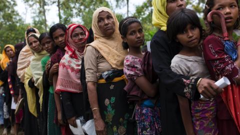 Rohingya refugee women queue for food rations after arriving from Myanmar to Bangladesh on September 10.
