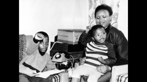 The children of Steve Biko give a Black Power salute as they sit at home with their aunt, Biko's sister Nobandile Mvovo, September 1977.