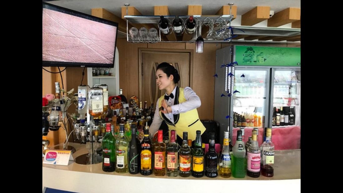 Bartender at the Rainbow floating restaurant in Pyongyang on September 10.
