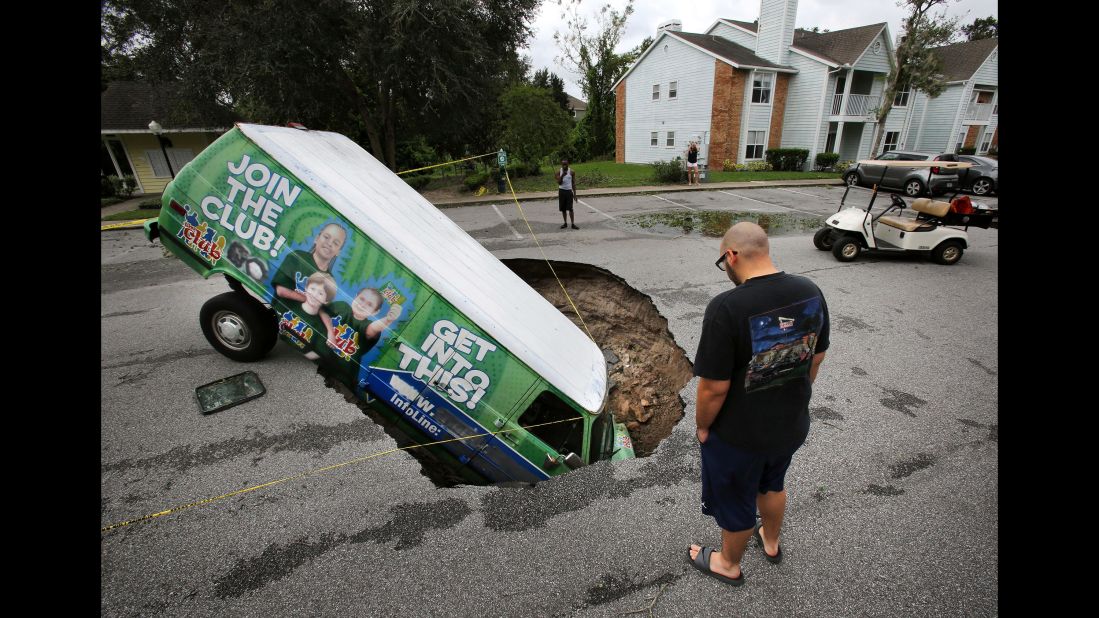A van sits in a sinkhole that opened up in Winter Springs, Florida, on September 11.
