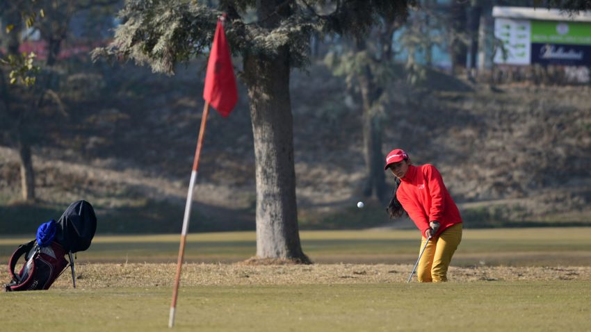In this photograph taken on January 18, 2017, young Nepalese golfer Pratima Sherpa hits a chip shot onto the green on a golf course in Kathmandu.
Pratima Sherpa grew up in a small hut behind the third hole of the Royal Nepal Golf Course -- now she is tipped to be the country's first female golf professional. / AFP / PRAKASH MATHEMA / TO GO WITH Golf-NEP,FOCUS by Annabel SYMINGTON
        (Photo credit should read PRAKASH MATHEMA/AFP/Getty Images)