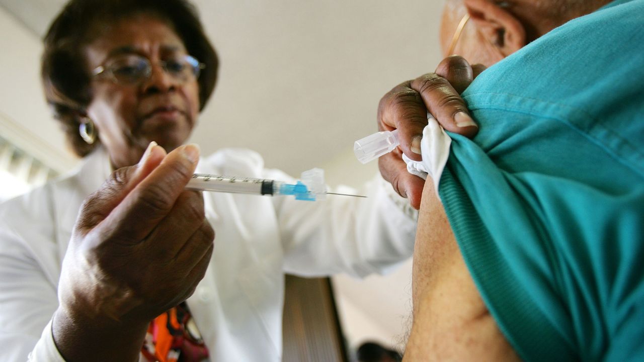 LOS ANGELES, CA - OCTOBER 26: Emily Moore administers an inoculation as free flu shots are given to people over 50 by the Los Angeles County Department of Health Services on October 26, 2005 in Los Angeles, California. An estimated 60 million flu shots will be given in the United States this season. (Photo by David McNew/Getty Images)