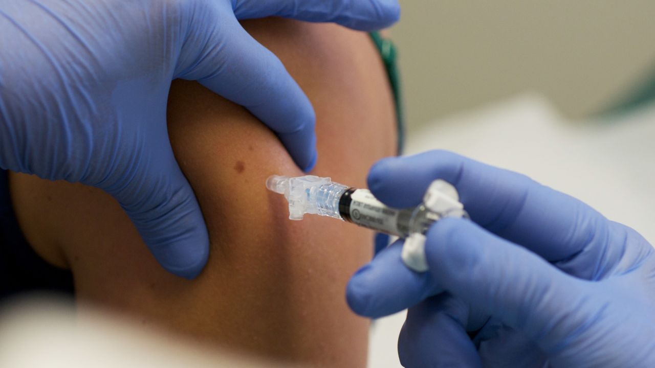 IOWA CITY, IA - AUGUST 11:  Marisa Grunder, 27 of Wilton, Iowa, is given a shot during trials of an H1N1 vaccine, developed by CSL of Australia, at University of Iowa Health Care, the University's medical center, on August 11, 2009 in Iowa City, Iowa.  The university's medical center is one of 8 trial sites across the nation conducting human studies on the new vaccine which is looking at optimal dosage levels for a variety of age groups. (Photo by David Greedy/Getty Images)