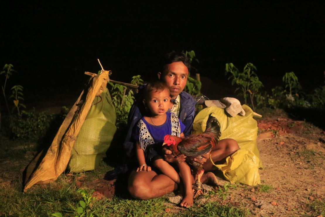 This man and boy made it to Bangladesh by boat with only a few posessions. 