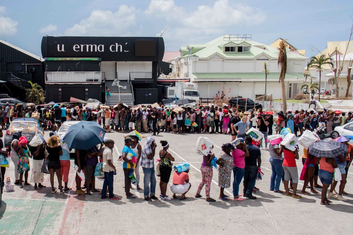 People line up for supplies in St. Martin on September 11.