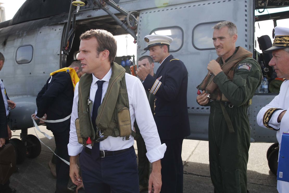 Emmanuel Macron waits on the tarmac in Guadeloupe before boarding a helicopter to St. Martin.  