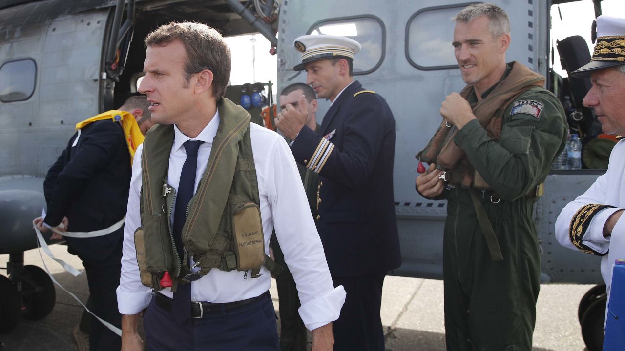 Emmanuel Macron waits on the tarmac in Guadeloupe before boarding a helicopter to St. Martin.  
