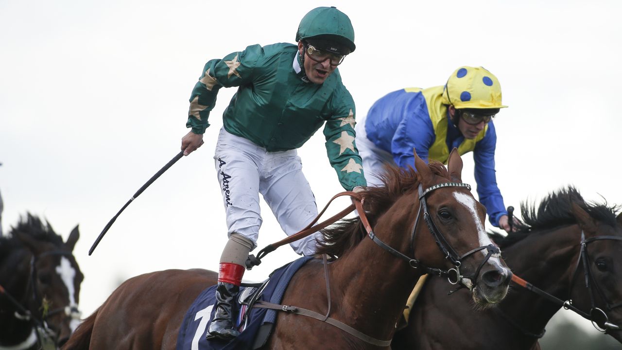 DUBLIN, IRELAND - SEPTEMBER 09:  Andrea Atzeni riding Decorated Knight (C, green) celebrate winning The Qipco Irish Champion Stakes at Leopardstown racecourse on September 9, 2017 in Dublin, Ireland. (Photo by Alan Crowhurst/Getty Images)