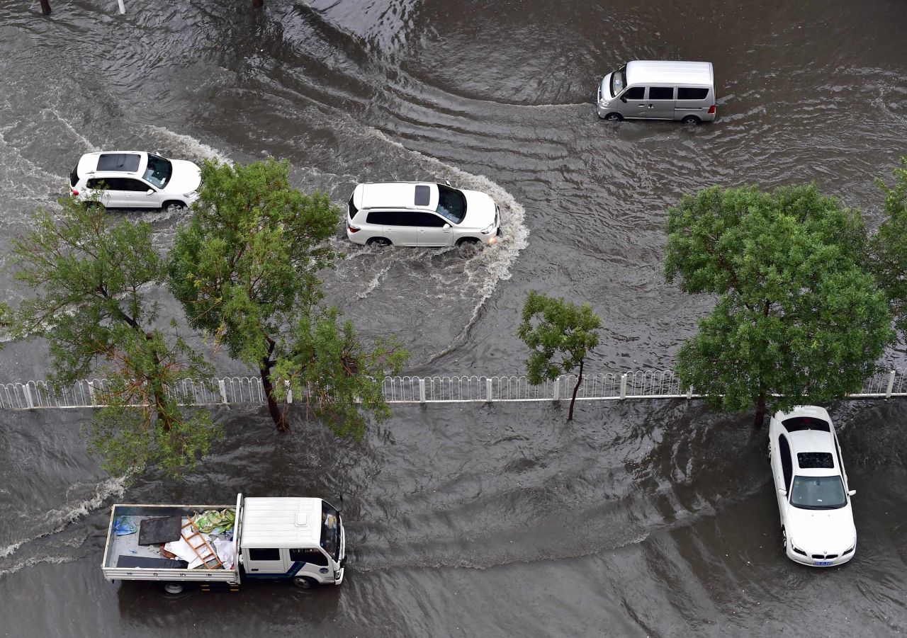 During the 2016 floods in Tianjin, an orange alert was issued -- during which time drivers navigated their vehicles through flooded roads.
