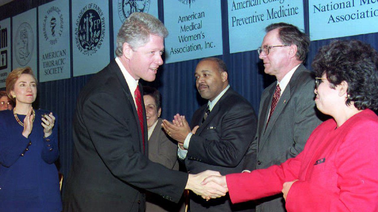 WASHINGTON: US President Bill Clinton talks to Dr. Elena Rios and other physicians that announced their support for his health reform package during a ceremony at the White House. Behind Clinton is First Lady Hillary Clinton on December 16.