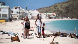 TOPSHOT - People inspect the damage on the Grand-Case Bay beach on September 11, 2017 on the French Caribbean island of Saint-Martin after it was hit by Hurricane Irma. / AFP PHOTO / Martin BUREAU        (Photo credit should read MARTIN BUREAU/AFP/Getty Images)