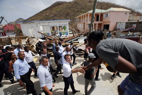 French President Emmanuel Macron shakes hands with St. Martin residents during a visit to the island on September 12.