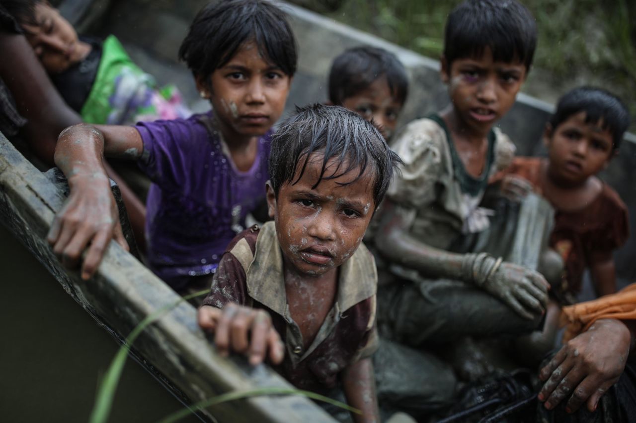 Rohingya children flee the Rakhine state by boat on Tuesday, September 12.