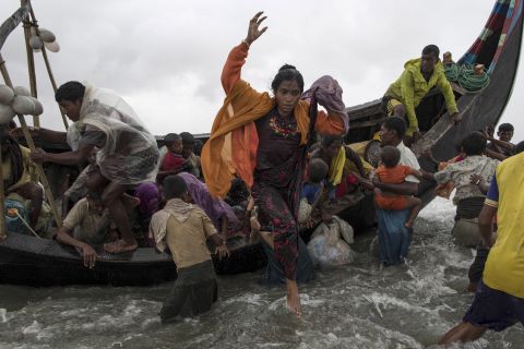 Refugees jump from the boat in Dakhinpara on September 12.