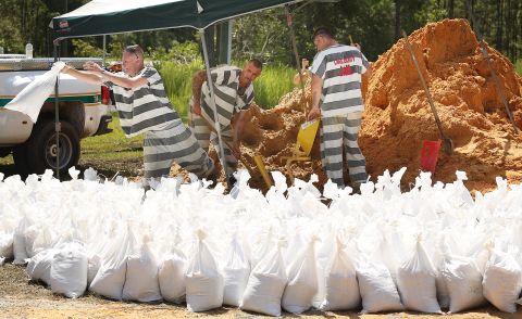 Lake County jail inmates fill sandbags in Astor, Florida, on September 13.