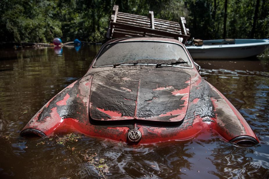 A classic Volkswagen sits in floodwaters September 13 in Middleburg, Florida.  Flooding from the Black Creek topped the previous high-water mark by about 7 feet.
