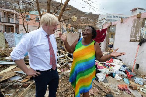 UK Foreign Secretary Boris Johnson talks to a resident of Anguilla during a visit on September 13. 