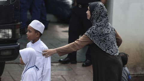 A relative of a teenage student cries after a fire broke out at a religious school in Kuala Lumpur, Malaysia, 14 September.