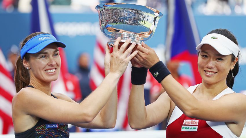 NEW YORK, NY - SEPTEMBER 10:  Martina Hingis of Switzerland and Yung-Jan Chan of Taiwan hold the championship trophy after defeating Lucie Hradecka of Czech Republic and Katerina Siniakova of Czech Republic after their Women's Doubles finals match on Day Fourteen of the 2017 US Open at the USTA Billie Jean King National Tennis Center on September 10, 2017 in the Flushing neighborhood of the Queens borough of New York City. Chan and Hingis won the match in the second set with a score of 6-3, 6-2.  (Photo by Al Bello/Getty Images)