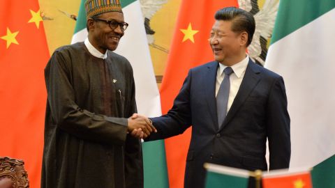 Nigerian President Muhammadu Buhari and Chinese President Xi Jinping shake hands at a meeting in 2016.