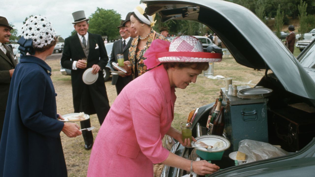 And, tailgating isn't just an American tradition: in this undated photo, these fancy-hatted spectators gather to eat and drink before the Melbourne Cup horse race in Melbourne, Australia.