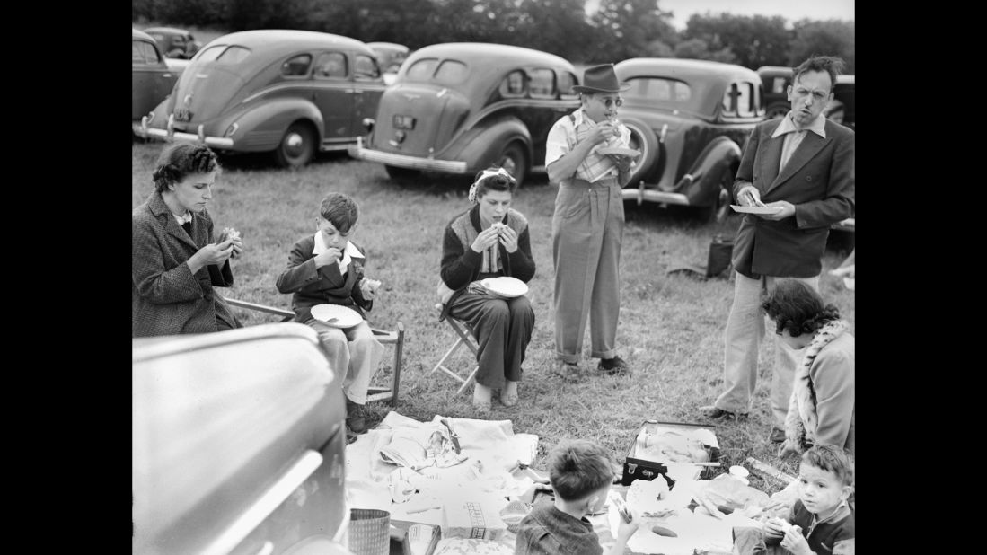 Sports fans started getting together to eat before a big game as far back as the 19th century. When cars became commonplace, these pre-game parties popped up in parking lots outside game venues - and the term "tailgating" emerged. Here, tailgaters in 1940s Chicago enjoy a picnic in the parking lot.  
