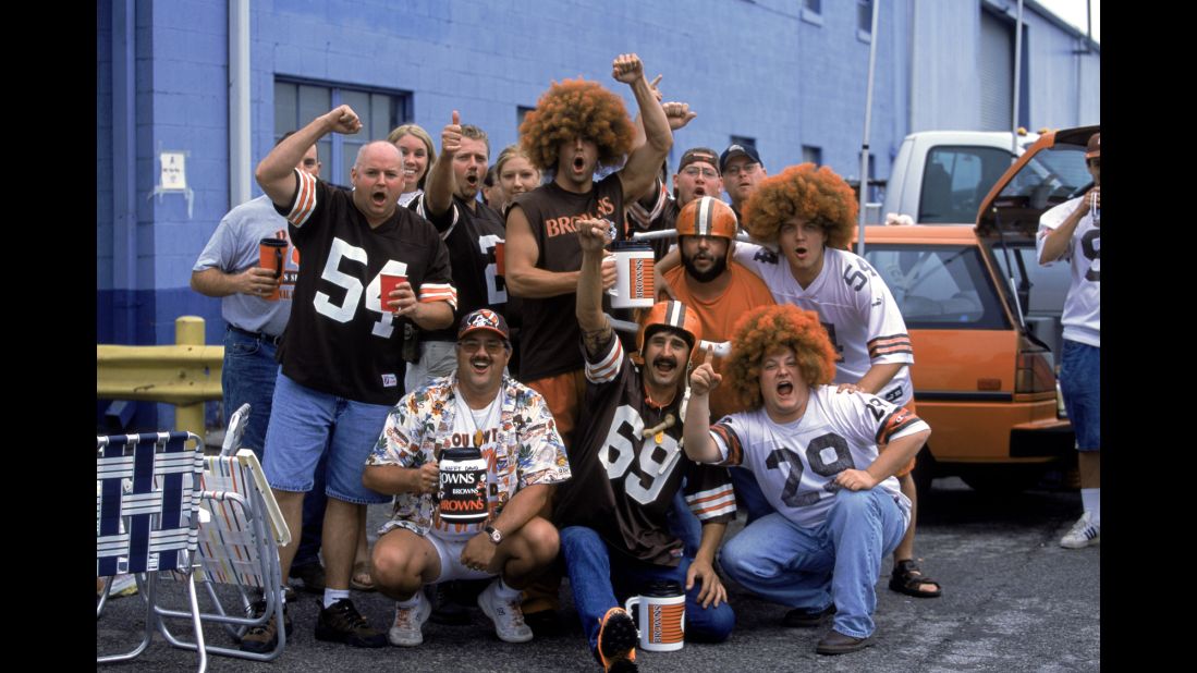 Snacks and beverages? Check. Funny wigs? Check. Team shirts/cups/flags? Yep. OK, sports fans, now all you need is the back of a vehicle, a few friends, and a few hours before the big game, and you're ready for a tailgating party - just like these Cleveland Browns fans in 2002. Here's a look at how tailgating has evolved over the years: