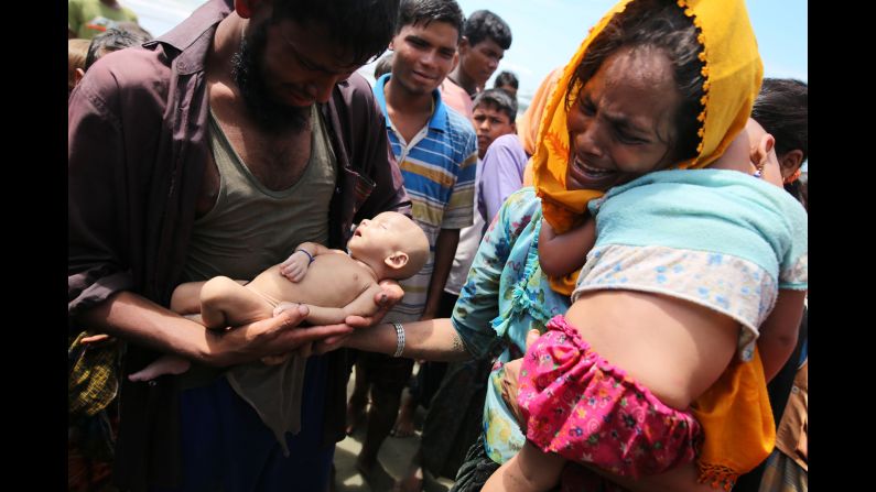 Rohingya refugees fleeing Myanmar hold their infant son Abdul Masood, <a href="http://www.cnn.com/2017/09/14/asia/myanmar-rohingya-muslim-family-mourns-infant-son/index.html" target="_blank">who died when their boat capsized</a> just before reaching Bangladesh on Wednesday, September 13. More than 370,000 Rohingya <a href="http://www.cnn.com/2017/09/13/asia/gallery/rohingya-refugee-crisis/index.html" target="_blank">have fled to Bangladesh</a> since August 25, according to the United Nations. <a href="http://edition.cnn.com/specials/asia/rohingya" target="_blank">The Rohingya</a> are a Muslim minority who live in Myanmar's Rakhine state but are not recognized as citizens by the government. They are considered by human-rights groups to be among the world's most persecuted people.
