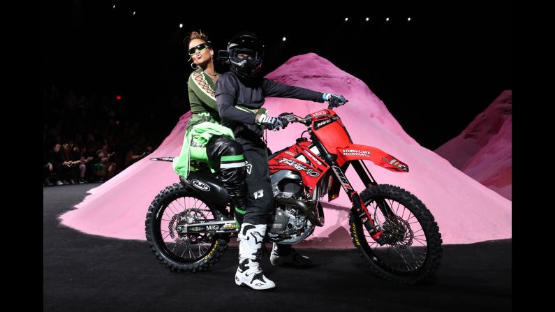 Singer Rihanna rides on the back of a motorbike during her Fenty Puma fashion show in New York on Sunday, September 10.