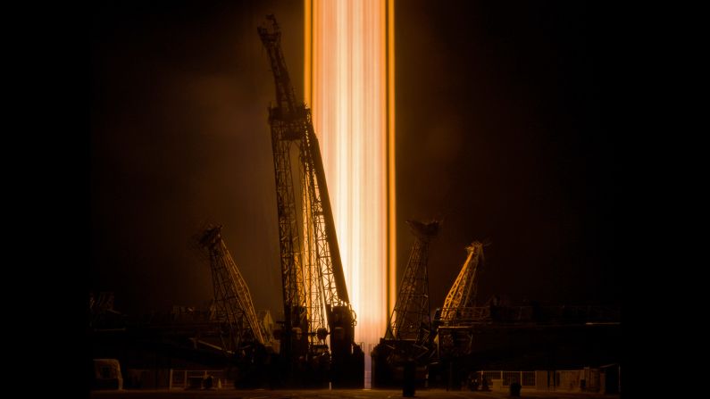 In this long-exposure photo, a rocket blasts off from the Baikonur Cosmodrome in Kazakhstan on Wednesday, September 13. It carried three men to the International Space Station.