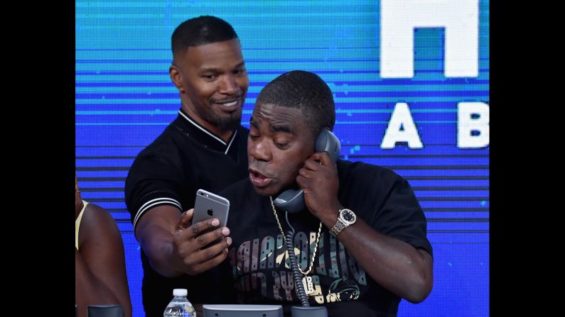 Jamie Foxx shows a phone to fellow actor Tracy Morgan as they take part in the "Hand in Hand" telethon in New York on Tuesday, September 12. <a href="http://www.cnn.com/2017/09/12/entertainment/harvey-irma-celebrity-telethon/index.html" target="_blank">More than 60 celebrities took part in the telethon,</a> which raised money for hurricane relief.