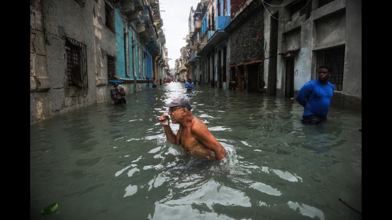 A man wades through a flooded street in Havana, Cuba, on Sunday, September 10. Hurricane Irma battered central Cuba before moving toward Florida.