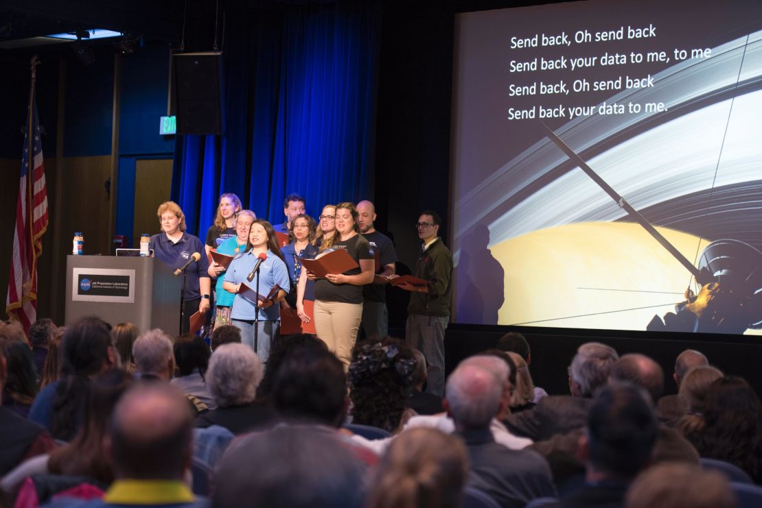 The Cassini Virtual Singers perform space-centric parodies of popular songs in front of a crowd at NASA's Jet Propulsion Laboratory in Pasadena, California.