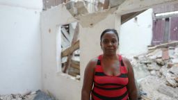 Litza Peñalver Sierra stands on Wednesday, September 13,  in the rubble strewn apartment where two brothers died after Hurricane Irma caused their ceiling to cave in on them. Penñalver's family lives in the same building and she is afraid they also could die there if the rest of the building collapses. 