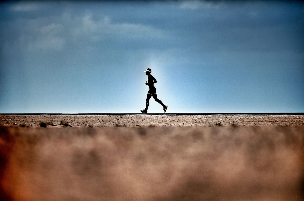 A man runs in the desert heat during the Challenge Triathlon Dubai. Despite scorching temperatures, running is a popular pursuit in the emirate, which is home to one of the world's richest marathons.<br /><br /><em>Scroll through the gallery to explore some of the Middle East's toughest races.</em><br />