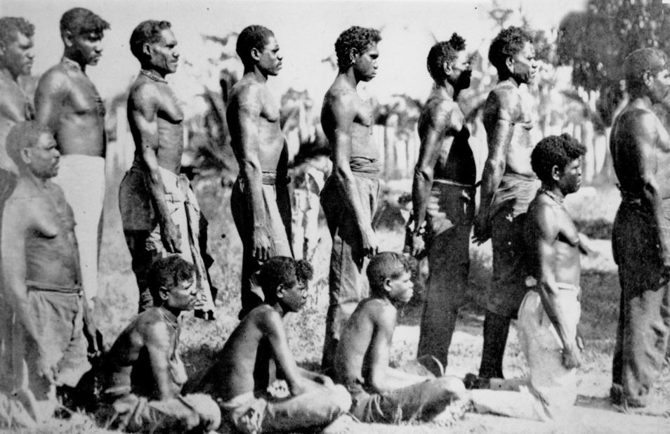 Taken in Queensland, where Semu shot his recreated photographs, this image from 1913 shows indigenous men in the remote town of Aurukun.