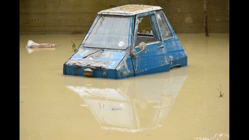 A car is partially submerged in Livorno, Italy, on Sunday, September 10, after heavy rainstorms <a href="http://www.cnn.com/2017/09/11/europe/tuscany-flooding/index.html" target="_blank">triggered severe flooding</a> in the Tuscany region.