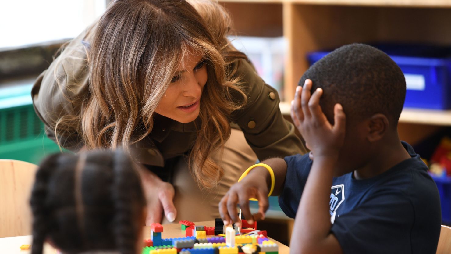 First lady Melania Trump speaks with a student as she visits a youth centre at  Joint Andrews Airforce base, Maryland on September 15, 2017.