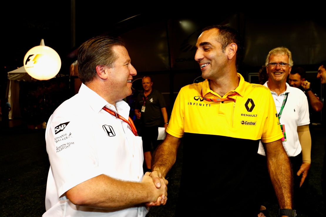 McLaren team boss Zak Brown (left) shakes hands with Renault Sport F1 managing director Cyril Abiteboul in Singapore following the announcement of the engine deal.