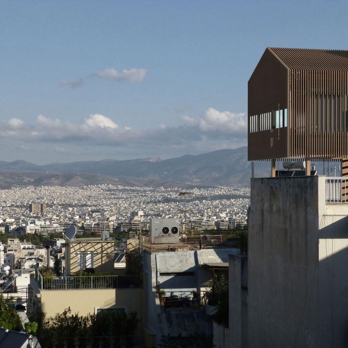 A rooftop attachment designed by Panos Dragonas and Varvara Christopoulou, shown in this rendering with Athens as a background.