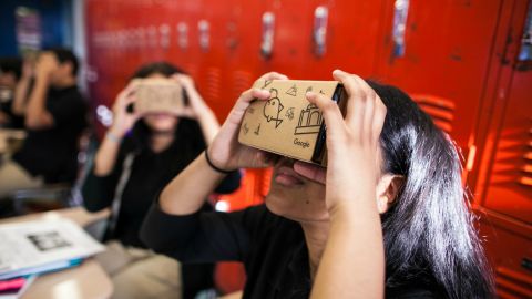 Pupils can slide a smartphone into a cardboard headset.