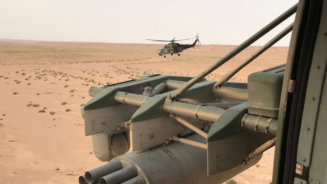 Russian military helicopters race across the eastern Syrian desert toward Deir Ezzor.