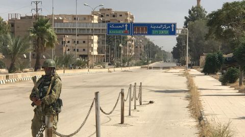 A soldier patrols on a street in Deir Ezzor in eastern Syria.