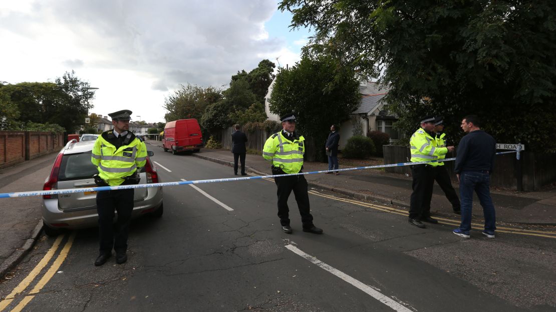 Officers stand guard at the perimeter of a police cordon in Sunbury on Saturday. 