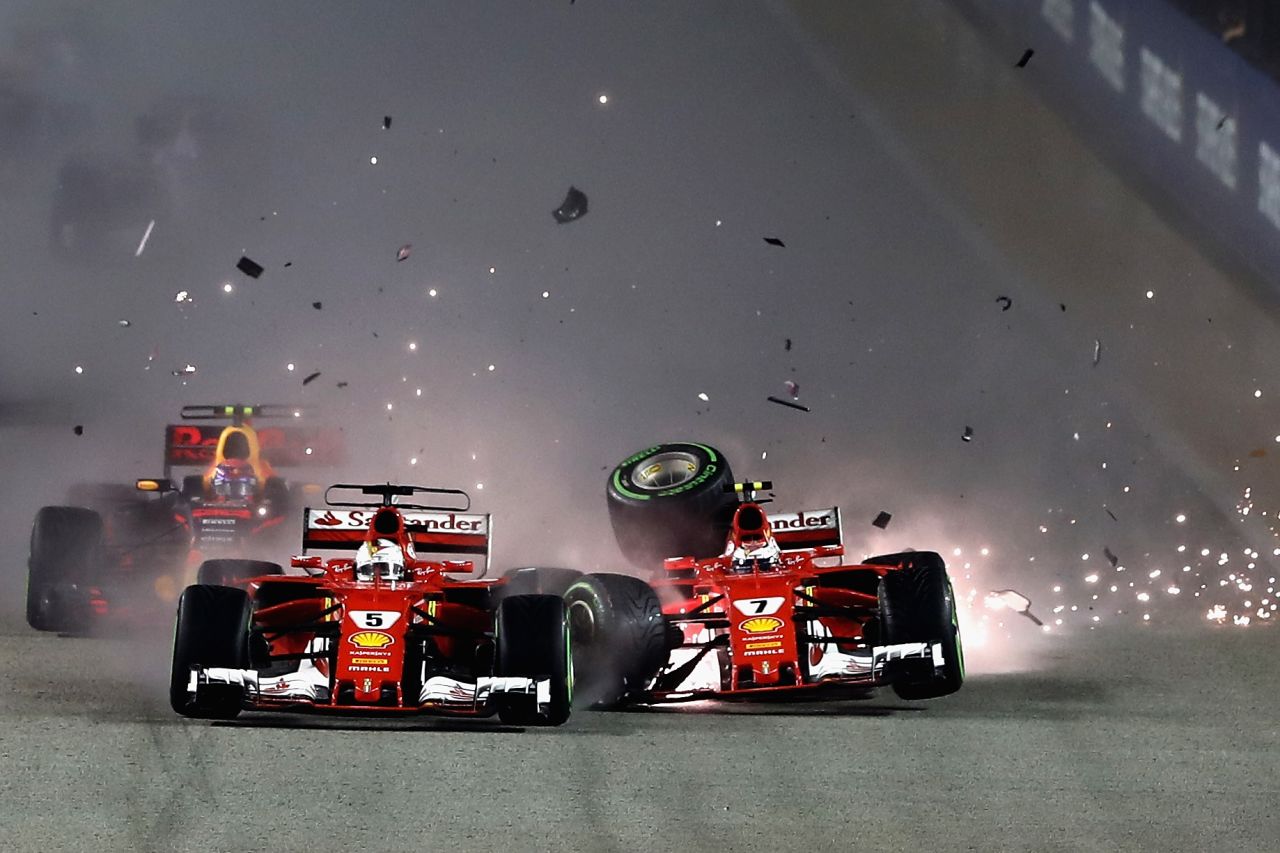 Disaster strikes for Ferrari in Singapore as both Vettel and Raikkonen crash out on the opening lap -- Raikkonen hit his teammate after colliding with Max Verstappen at the start. Lewis Hamilton, who started from fifth, avoids trouble and quickly assumes the lead which he holds to the checkered flag. The win, his third at the Singapore GP extends the Briton's lead over Vettel to 28 points. <br /><br /><strong>Drivers' title race after round 14</strong><br />Hamilton 263 points<br />Vettel 235 points<br />Bottas 212 points