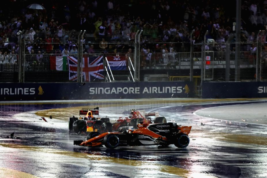 Fernando Alonso (foreground) was caught up in the crash between Max Verstappen and Kimi Raikkonen at the start of the Singapore Grand Prix 