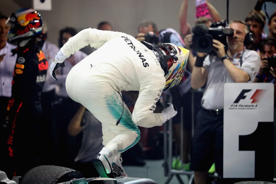 Lewis Hamilton celebrates his third career win in Singapore. 